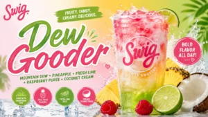 A refreshing drink featuring tropical fruits, served in a clear glass with condensation and a slice of fruit on the rim.